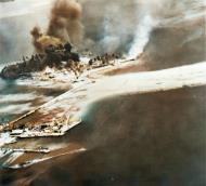 Asisbiz Tanambogo Island under bombardment by USN ships and carrier aircraft Guadalcanal Tulagi Operation on 7th Aug 1942 NH 97747
