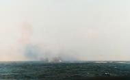 Asisbiz USS Nashville (CL 43) firing her 6 inch main battery at a Japanese picket boat encountered by the task force 18th April 1942 NH 97500