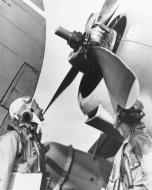 Asisbiz Curtiss SB2C 1C Helldiver crew aboard USS Essex (CV 9) examine the damaged propeller over Marcus Island Raid 19 20th May 1944 01
