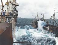 Asisbiz USS Essex (CV 9) and T2 SE A1 oiler USS Tallulah AO 50 refueling in heavy seas off Luzon 9th Nov 1944 01