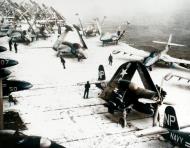 Asisbiz USS Essex (CV 9) flight deck wait for snowy weather to break of Korea 18th Jan 1952 80 G 437710