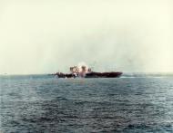 Asisbiz USS Essex (CV 9) hit by Japanese Judy kamikaze viewed from USS Ticonderoga (CV 14) off Luzon on 25th Nov 1944 80 G 270736