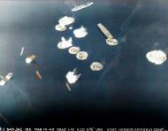 Asisbiz USS Essex (CV 9) planes attack Shimane Maru at Kure Naval Base Japan 19th March 1945 NH 95783