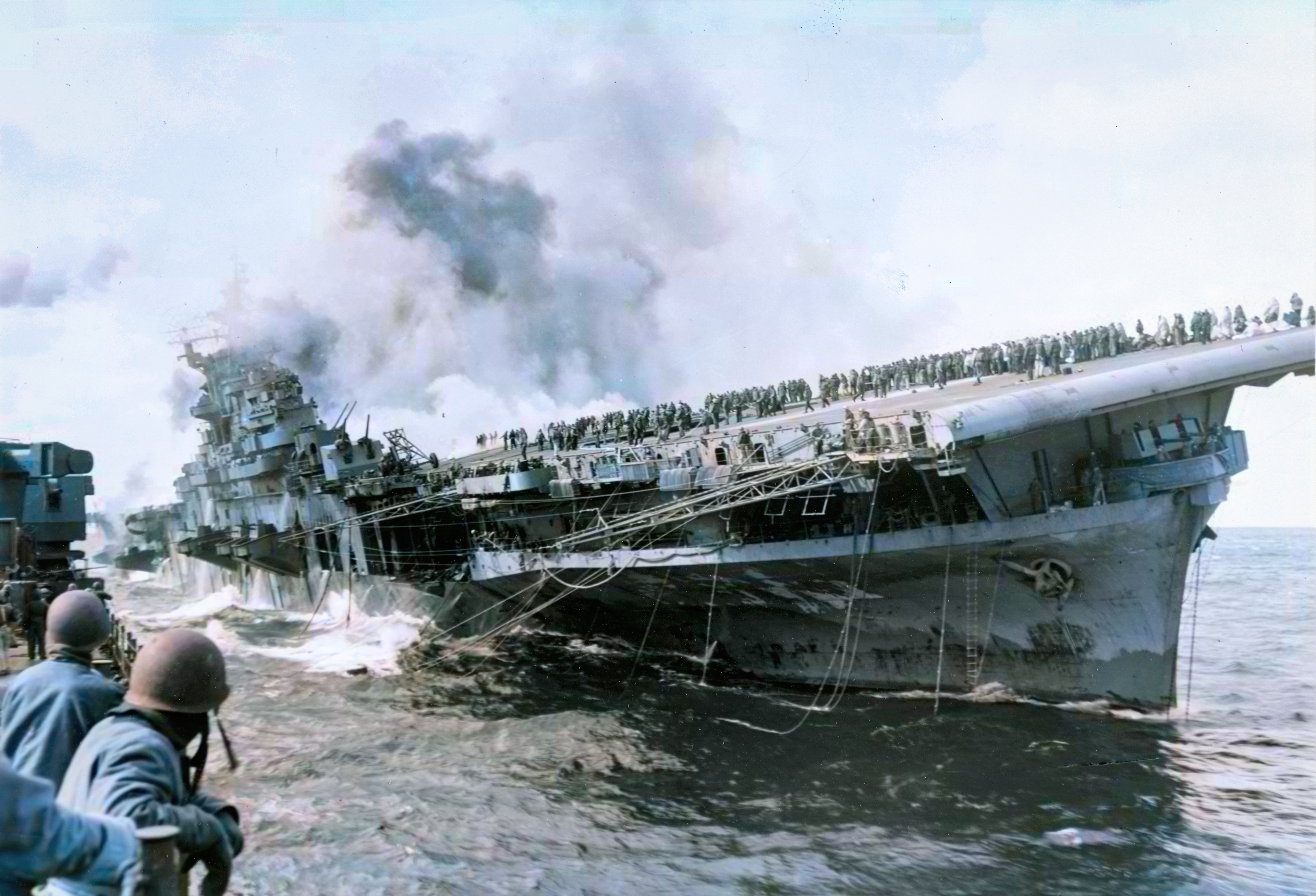 USS Franklin (CV 13) after she was hit by a Japanese air attack while operating off Japan 19th Mar 1945 80 G 273880
