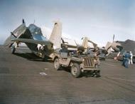 Asisbiz USS Gambier Bay (CVE 73) Grumman TBF Avenger being maneuvered into position on the flight deck 01