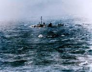 Asisbiz Fletcher class destroyer suffering in heavily swell typhoon Cobra seen from USS Essex 13th Jan 1945 NH 89375x