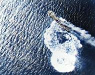 Asisbiz Japanese cargo ship under attack by USS Langley (CVL 27) planes in Masbate Harbor Philippines Sep 1944 80 G 281083