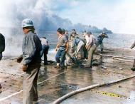 Asisbiz USS Langley (CVL 27) flight deck after being hit by a Kamikaze off Formosa 21st Jan 1945 80 G 273422