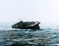 Asisbiz USS Langley (CVL 27) rolling sharply as she rides out Typhoon Cobra from USS Essex (CV 9) 13th Jan 1945 80 G 305484