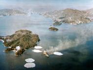 Asisbiz Japanese battleship Hyuga under air attack at Kure by USS Lexington II (CV 16) 24th July 1945 80 G 490154