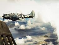 Asisbiz USS Lexington II (CV 16) SBD Dauntless dive bombers over Tanapag Harbor Saipan during the D day landings on 15th June 1944 80 G 236951