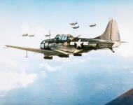 Asisbiz USS Lexington II (CV 16) SBD Dauntless dive bombers over Tanapag Harbor Saipan during the D day landings on 15th June 1944 80 G 236958