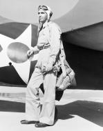 Asisbiz Lt Edward H Butch O'Hare USN Stands by the tail of an F4F Wildcat fighter circa April May 1942 80 G K 892 A