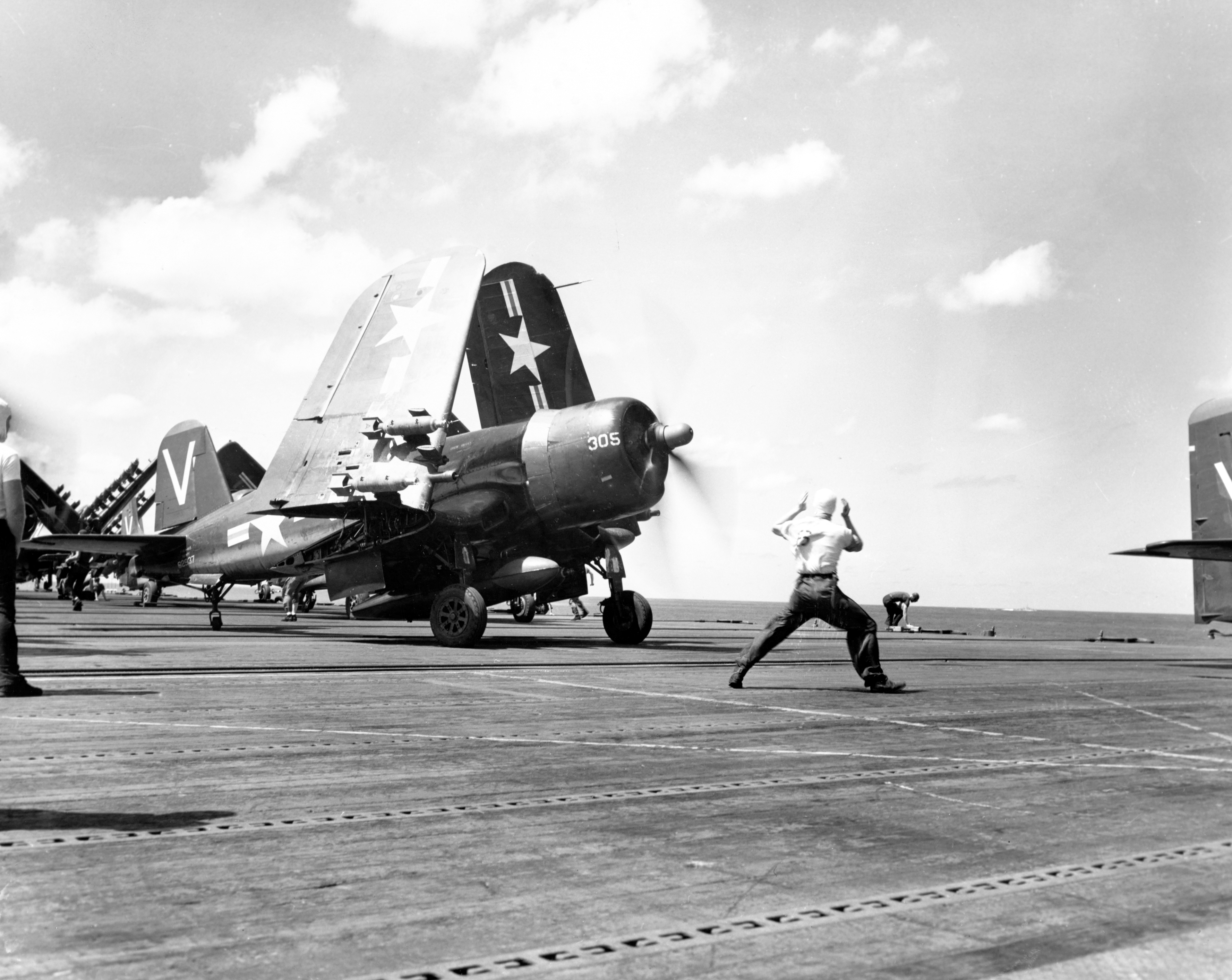 Vought F4U 4B Corsairs of VF 113 V305 62937 prior to a strike mission in Korea 19th Oct 1950 80 G 420932