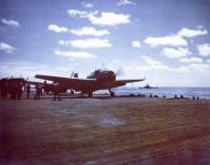 Asisbiz USS Randolph (CV 15) a TBM Avenger and two F6F Hellcat on the flight deck during operations in the Western Pacific 80 G K 5373