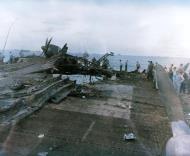 Asisbiz USS Randolph (CV 15) showing damage to her after flight deck resulting from a kamikaze hit 11th March 1945 80 G 274104