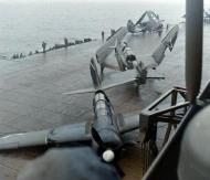Asisbiz USS Ticonderoga (CV 14) SB2C 4E Helldiver (VB 87) V215 landing damaged hits V209 off Japan July Aug 1945 01
