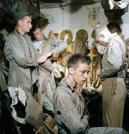 Asisbiz USS Ticonderoga (CVA 14) pilots slip into flight gear aboard for strike on Manila Philippines 5th Dec 1944 80 G 415478