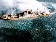 Asisbiz Japanese cargo ship sinking after being torpedoed from TF38.3 aircraft Saigon area 12th Jan 1945 ASC