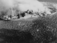 Asisbiz Japanese cargo ship sinking after being torpedoed from TF38.3 aircraft Saigon area 12th Jan 1945 NH 95787