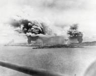 Asisbiz Fires rage at a fuel dump and the Charan Kanoa sugar refinery (right) Saipan Invasion June 1944 80 G 238357