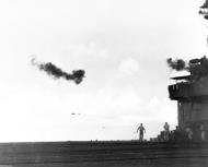 Asisbiz Japanese Frances medium bomber burning as it crosses the bow of USS Corregidor 18th Jun 1944 80 G 238339