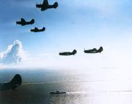 Asisbiz USS Yorktown II (CV 10) SB2C 1 Helldiver return to task force 58 carriers after strikes on Chichi Jima 6th July 1944 80 G 241042
