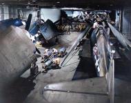 Asisbiz USS Yorktown II (CV 10) ordnancemen working on F6F 3 Hellcat in the carrier's hangar deck circa Oct Dec 1943 80 G 419959