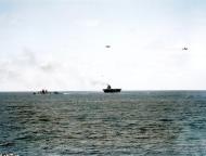 Asisbiz Two Douglas SBD 3 Dauntless scout bombers fly near USS Yorktown (CV 5) at about 1330 hrs Battle of Midway 4th Jun 1942