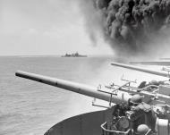 Asisbiz USS Astoria (CA 34) steams by USS Yorktown (CV 5) after the carrier had been hit by three Japanese bombs on 4th June 1942 80 G 312019